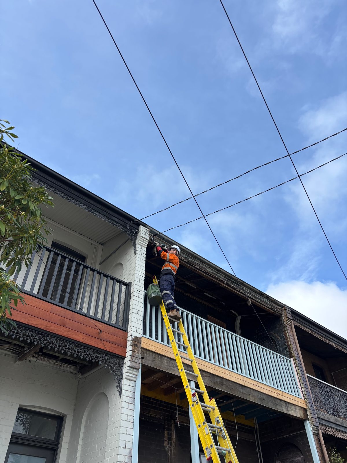Master Connections Electrical Pty Ltd electrician connecting an overhead service line in Sydney
